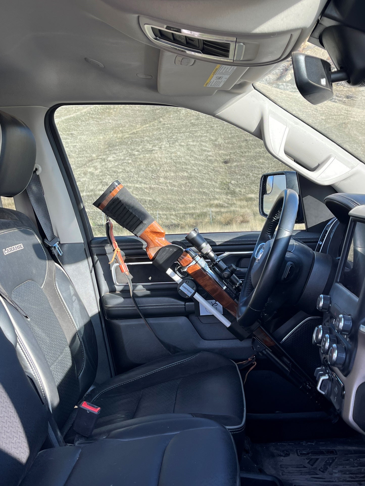Browning A-Bolt rifle safely secured in the Sidekick door mounted vehicle gun rack in a 2022 Ram 1500