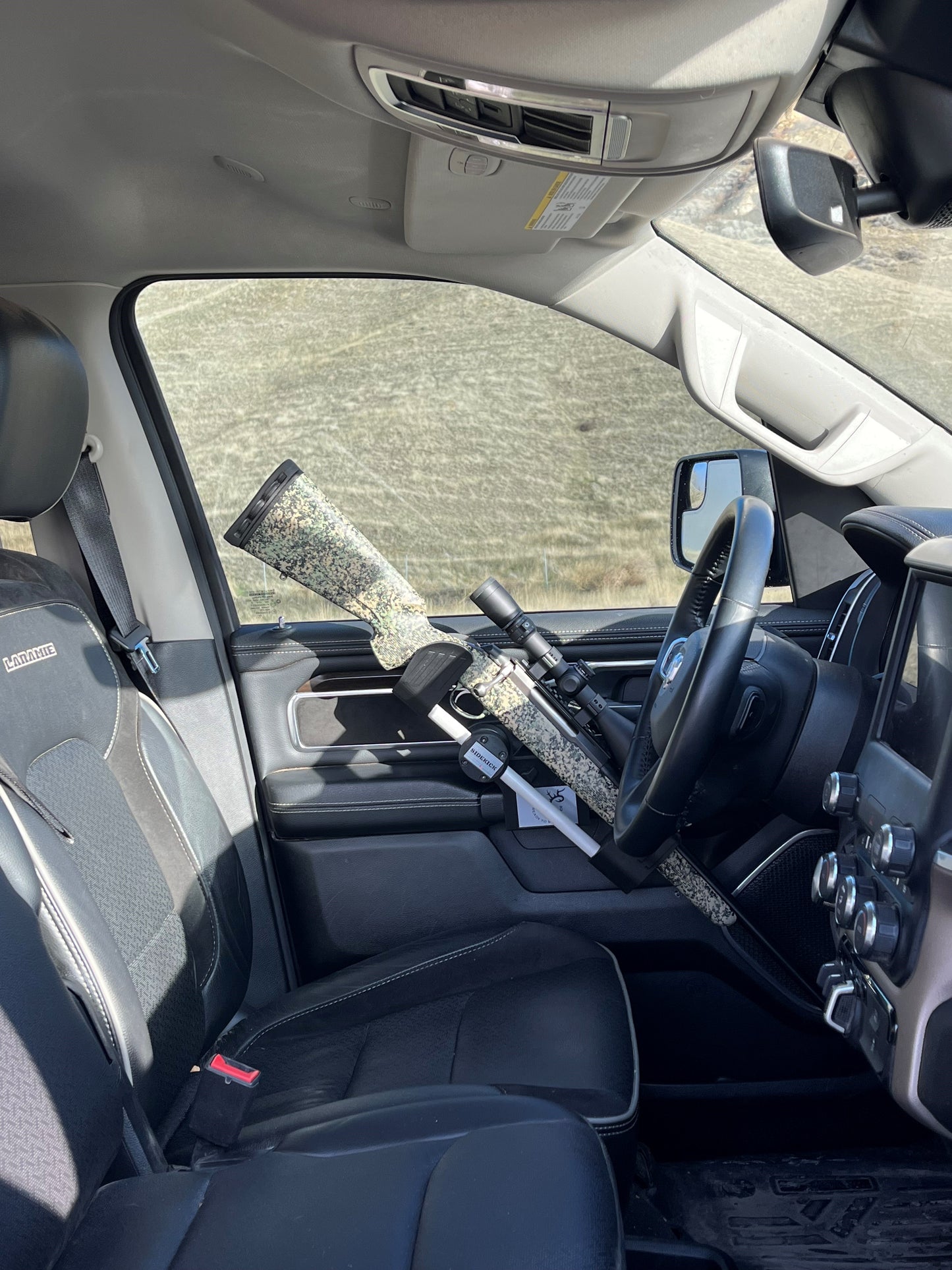Tikka T3 rifle safely secured in the Sidekick door mounted vehicle gun rack in a 2022 Ram 1500