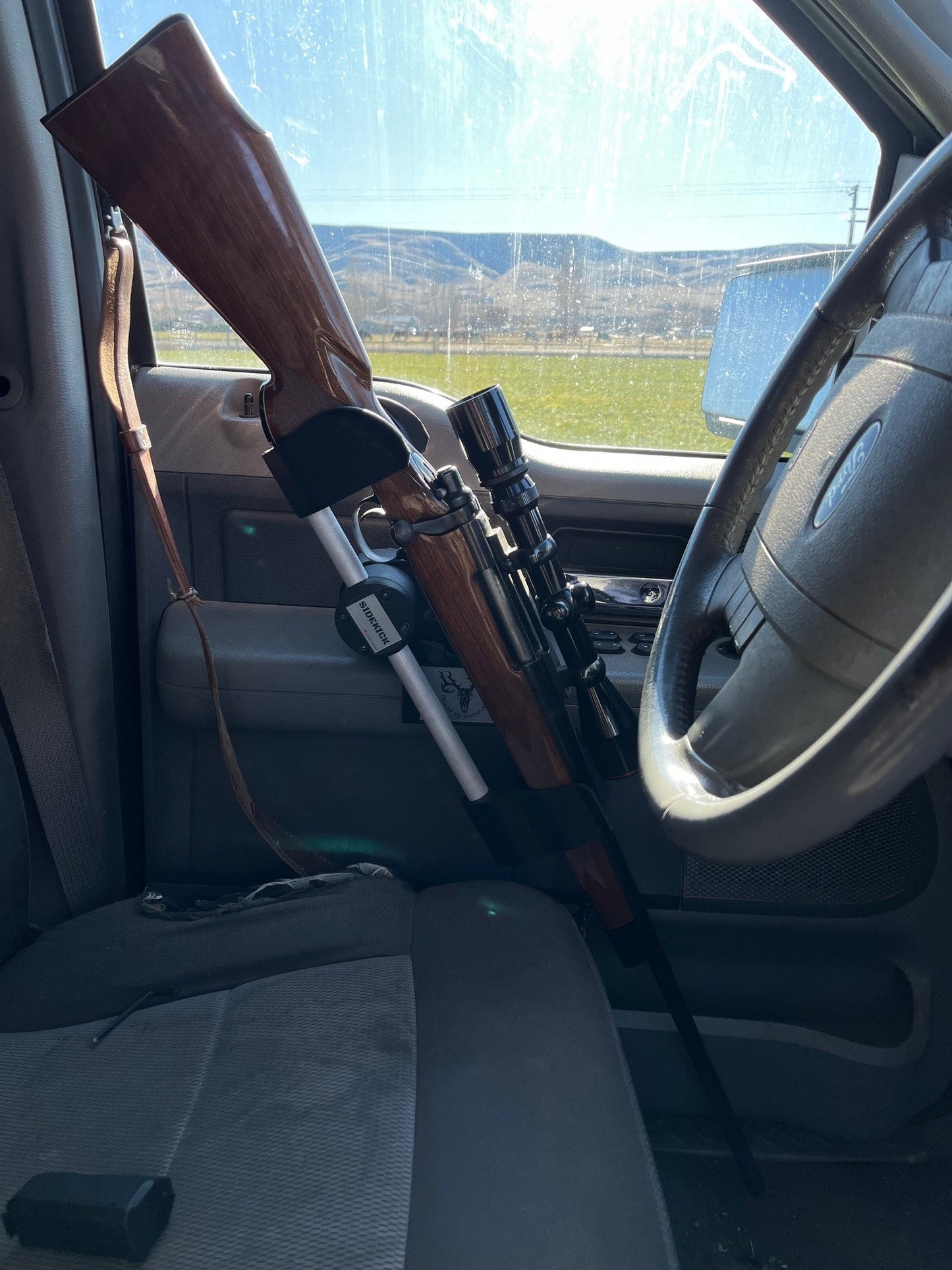 Remington 700 rifle safely secured in the Sidekick door mounted vehicle gun rack in a 2006 Ford F150