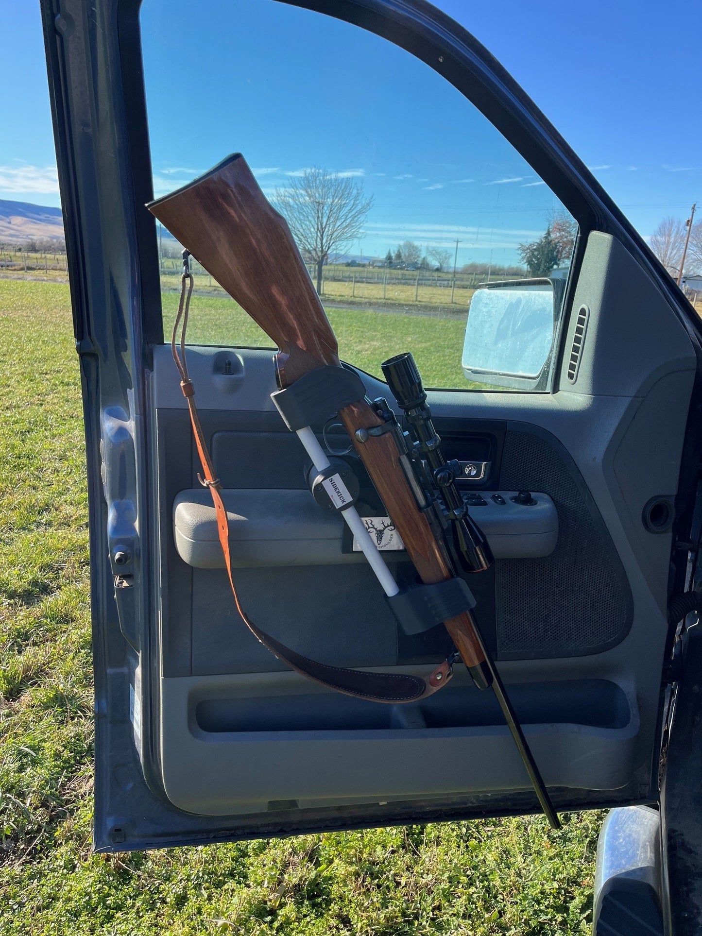 Remington 700 rifle safely secured in the Sidekick door mounted vehicle gun rack in a 2006 Ford F150